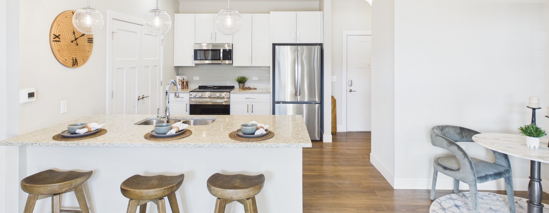 a kitchen with a table and chairs